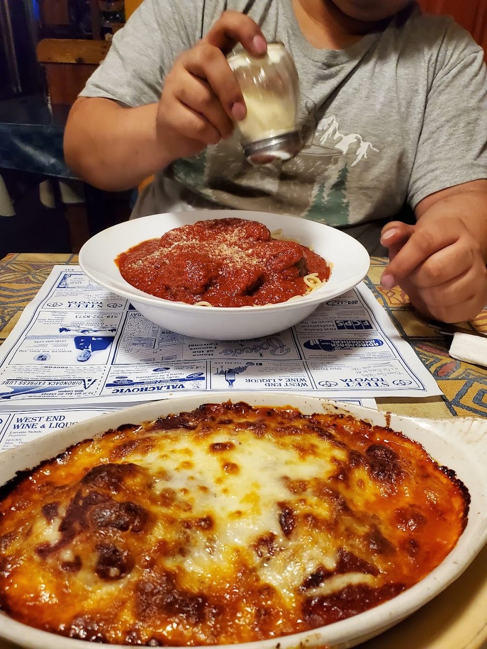 Printed menu with Italian dinners and seafood plates.