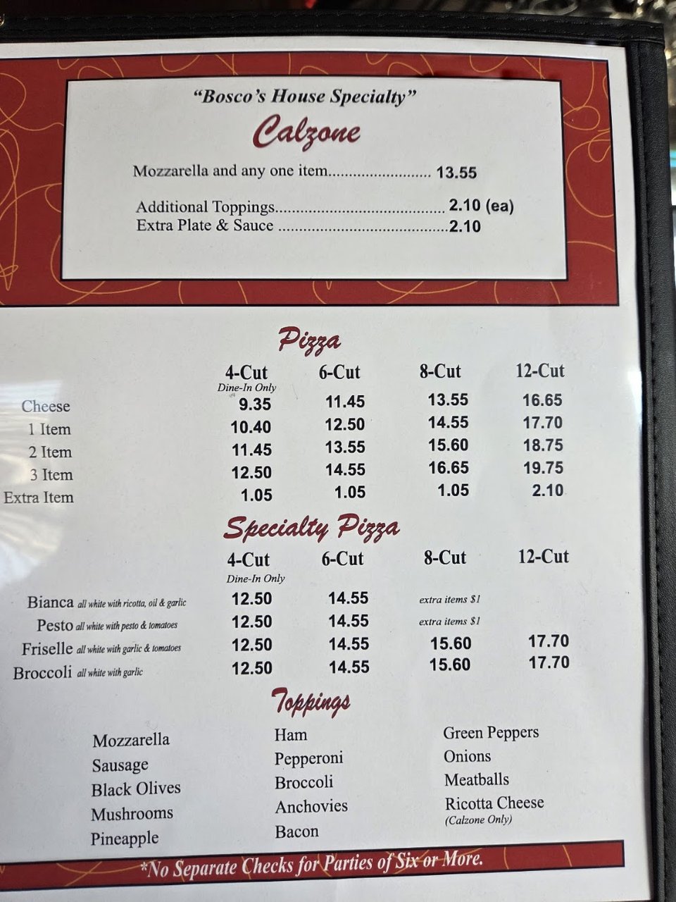 Close-up of menu sections for dinners and seafood.